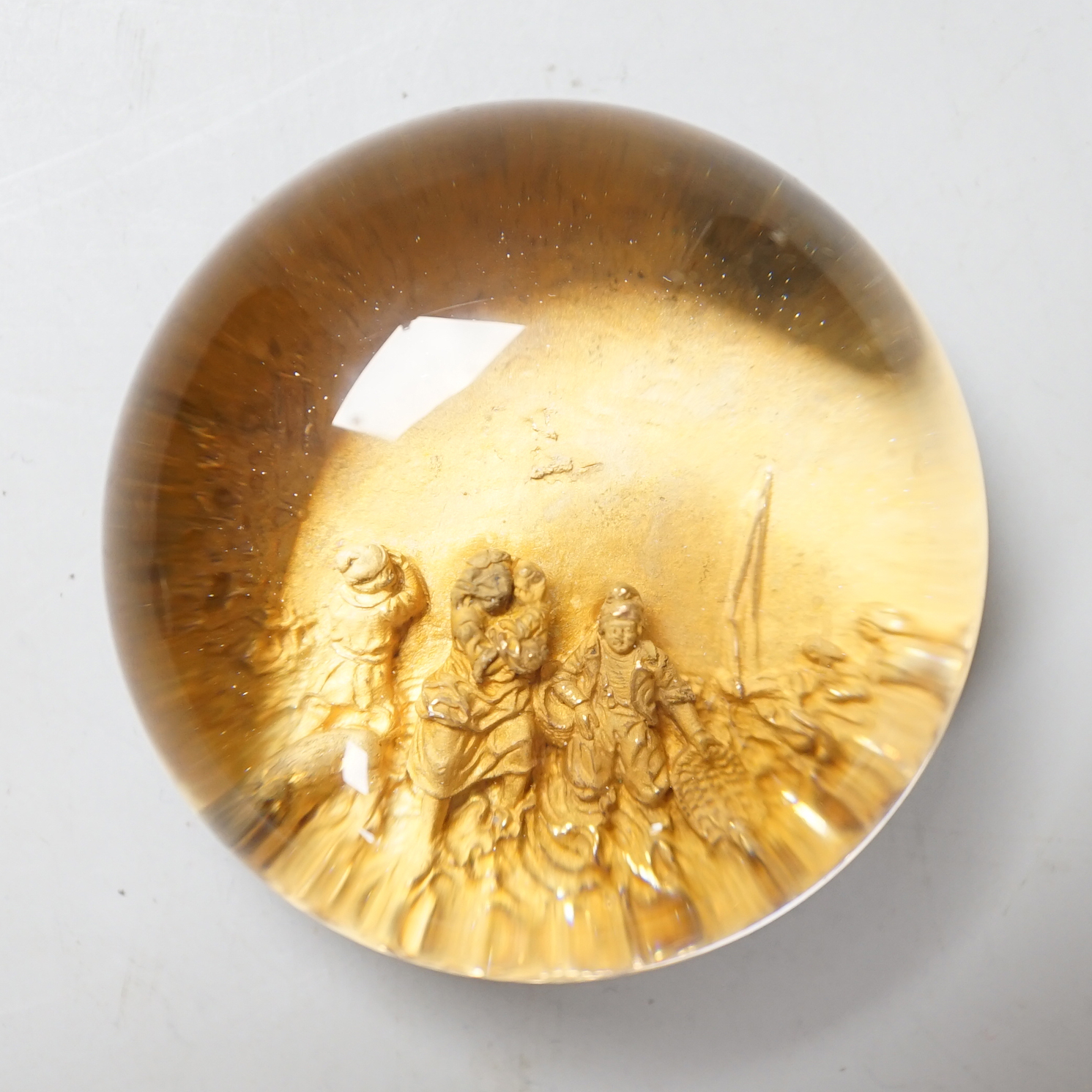A pinchbeck figural paperweight, approximately 6cm diameter